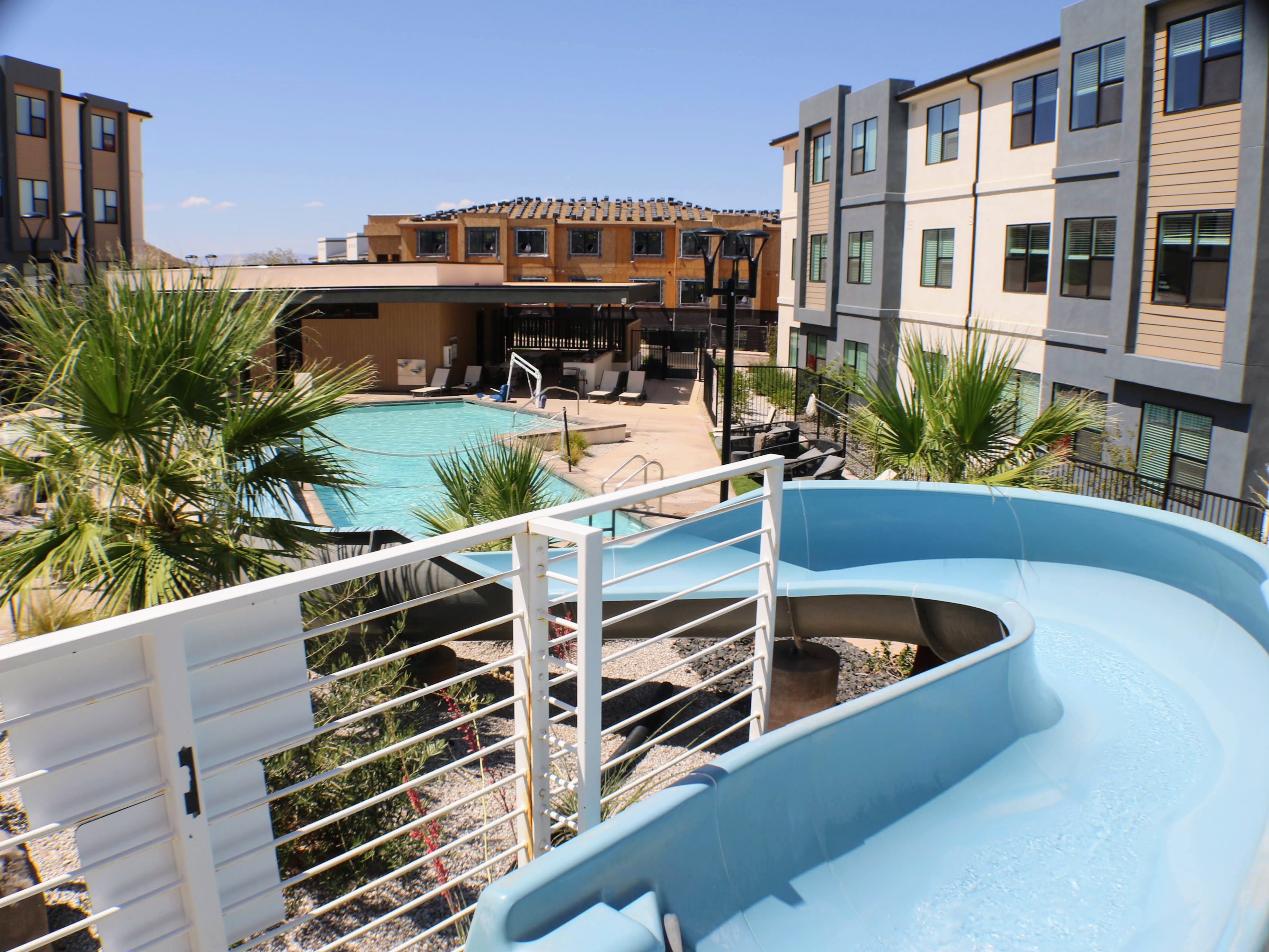 Curving waterslide overlooking the TERRA resort pool